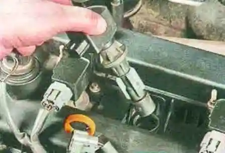 Removing the coils and spark plugs of a Mazda 6