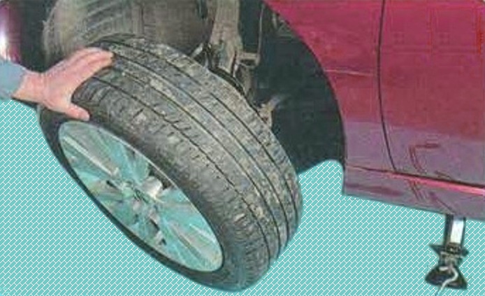 Checking Mazda brakes 6