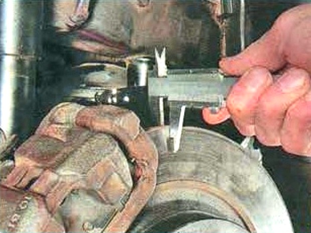 Checking Mazda brakes 6