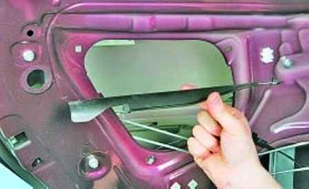 Disassembly and removal of rear side door of Hyundai Solaris