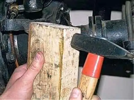 How to replace the front axle shaft and remove the steering knuckle of a UAZ car