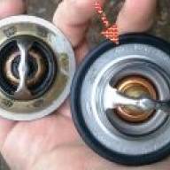 How to remove the thermostat and thermostat housing of a Nissan Almera car